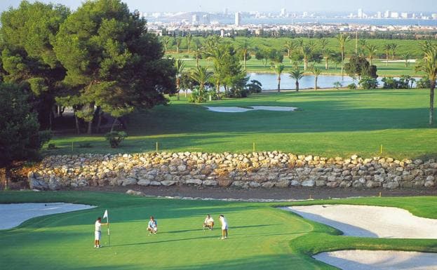 Several golfers play on a 'green' on the La Manga Club course. 