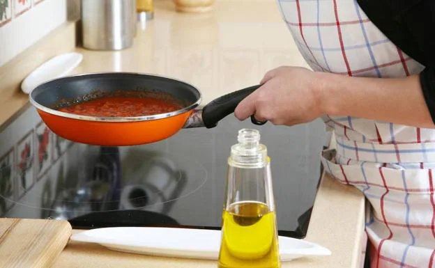 A person cooking with oil.