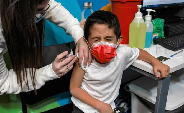 A child receives the Covid vaccine in a file image. 