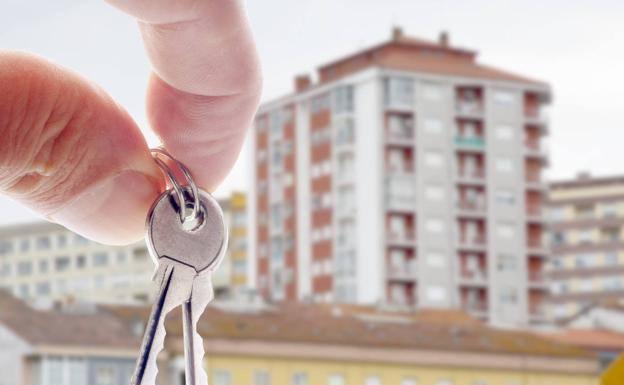 Some keys with a block of flats in the background.