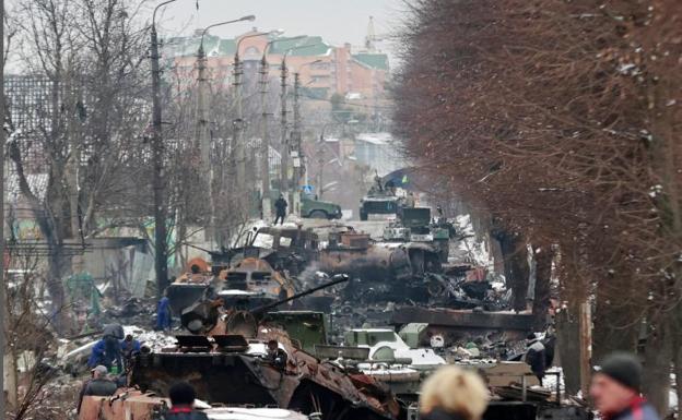 Destroyed military vehicles on a street in the city of Bucha in the Kiev region.