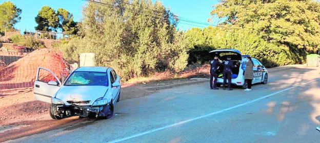 Local Police officers attend to a traffic accident on the Cresta del Gallo road. 