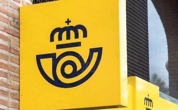 Correos logo on a facade.