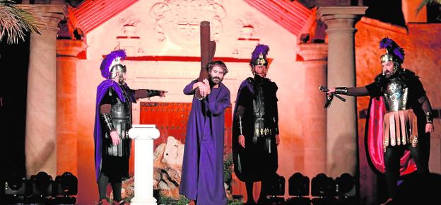 Jesus with the cross on his shoulder before the Roman centurions on Calvary last night. 