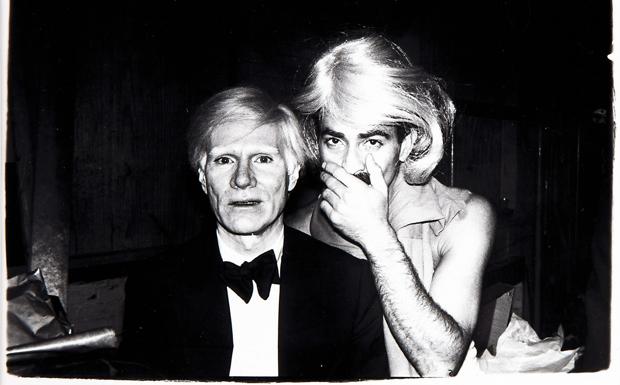 Andy Warhol with the artist Victor Hugo at the Studio 54 nightclub.