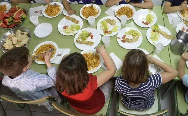A group of students eat in a school canteen at a school in Murcia, in a file image.