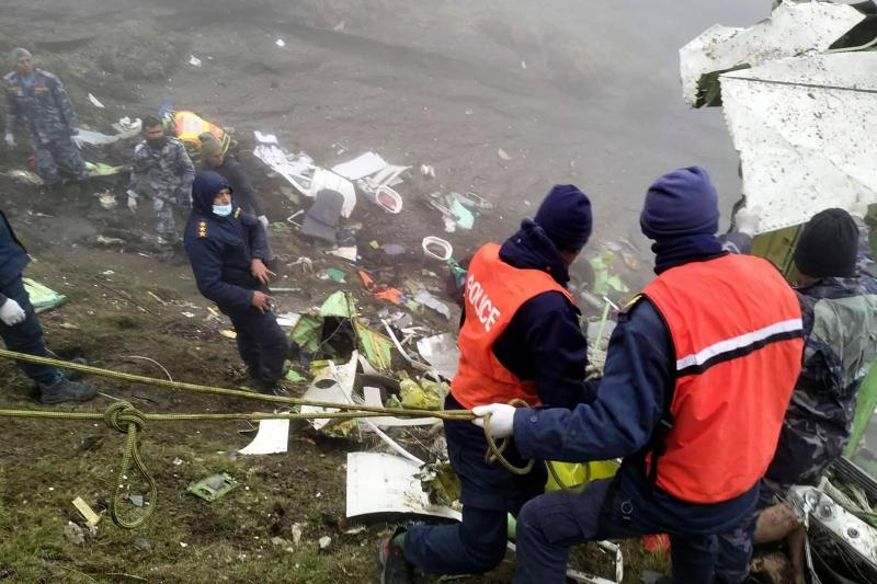 Rescue services, in the area where the remains of the damaged plane have been located. 
