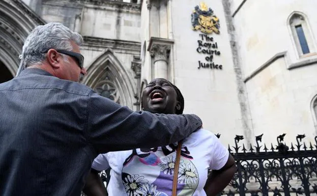 A human rights defender during a protest against sending migrants to Rwanda outside the High Court in London. 