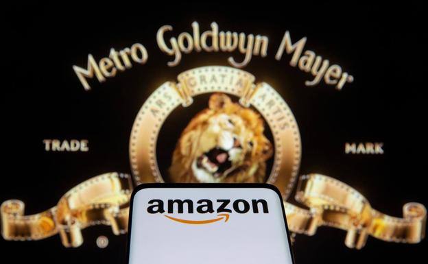 A mobile with the Amazon logo, in front of the MGM lion. 