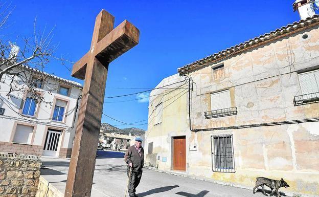 A neighbor walks down a street in Cañada de la Cruz, a district of Moratalla with about 150 inhabitants. 