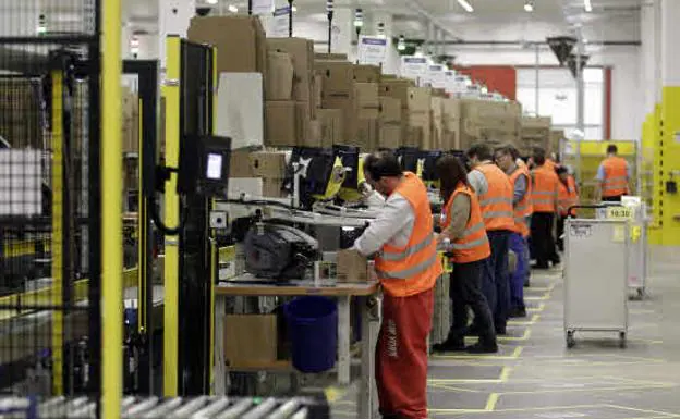 Workers at the Amazon fulfillment center in Briesleng, Germany. 