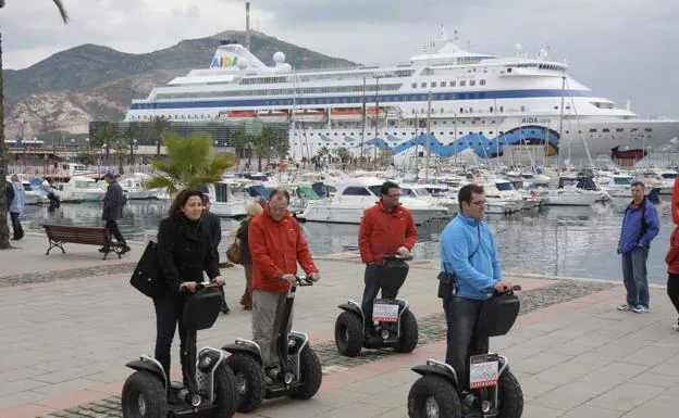 Tourists walk through Cartagena in a file image. 